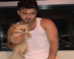 He is an animal lover and has one cute dog in his home.